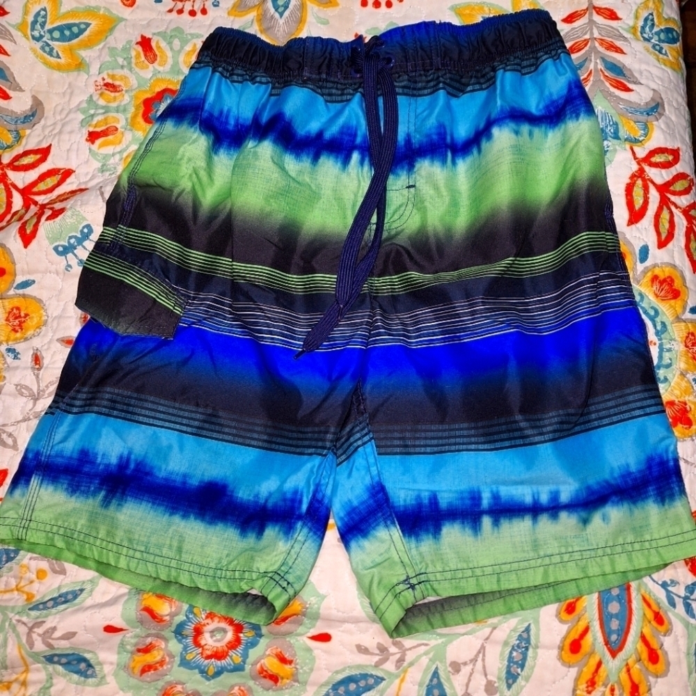A Kanu Surf men's swim trunks in a size medium. They're pre-loved in great shape